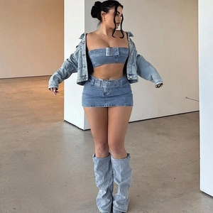Detail of four-piece denim set featuring buckled tube top and matching leg warmers