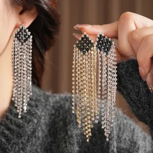 Vintage style rhinestone tassel drop earrings with geometric diamond shapes in gold and silver