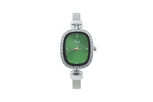 Close-up of elegant green oval dial watch with diamond-set bezel and silver mesh strap