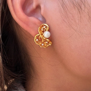 Elegant gold hollow twisted earrings with white pearl and sparkling zircon accents