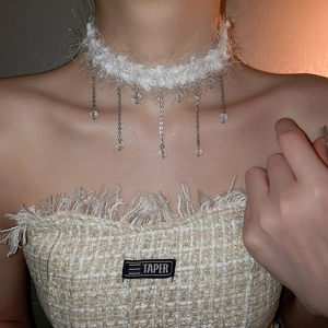 White faux fur choker necklace with dangling silver chains and crystal bead pendants