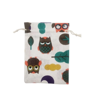 Detail of floral owl print on cotton linen drawstring gift pouch with durable rope closure