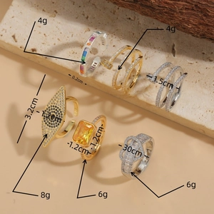 Set of gold and silver zircon open rings including evil eye and nail styles with dimensions