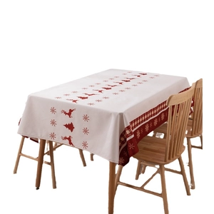 Polyester Christmas tablecloth featuring red reindeer and trees on a white background