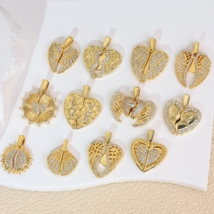 Zircon micro-paved gold heart and wing pendants set on elegant display plate