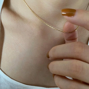 Minimalist gold ultra-thin necklace in polished stainless steel for layering