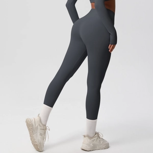 Rear view of charcoal grey high-waisted yoga leggings and long sleeve gym set