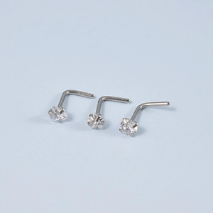 Three silver stainless steel L-shaped nose studs with clear round cubic zirconia