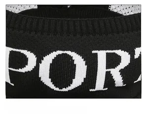 Macro shot of breathable knit fabric detail and white PORT embroidery on a black visor