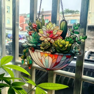 Close-up of lily of the valley acrylic suncatcher with metal chain hanging on a balcony