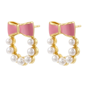 Elegant pink enamel bowknot pearl stud earrings with gold finish on white background