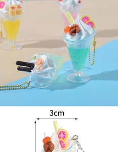 Macro view of artificial ice cream sundae keychain detail showing 3cm width dimension
