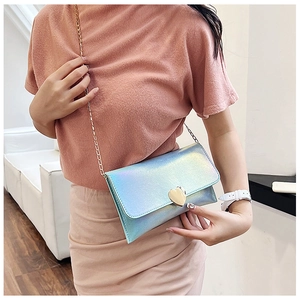 Chic iridescent holographic crossbody bag with gold heart-shaped metal lock and chain strap