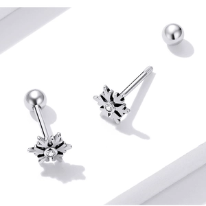 Detailed macro view of S925 sterling silver snowflake stud earrings with screw ball backs