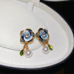 French style floral earrings with blue enamel petals, pearl drop, and gold finish