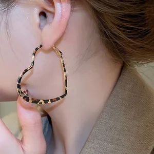 Chic heart-shaped leopard print hoop earrings for women with fashionable animal patterns
