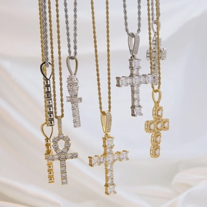 18k gold plated brass cross pendants with sparkling cubic zirconia on white silk