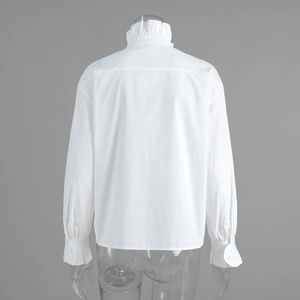 Detailed back view of white ruffled high neck shirt with elegant frilled long sleeve cuffs