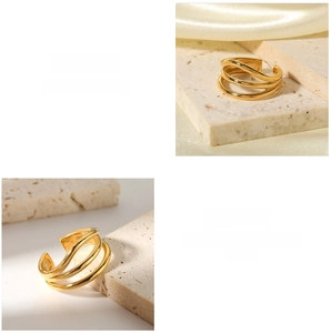 Detailed close-up of 18K gold-plated multilayer wavy ring with modern minimalist design
