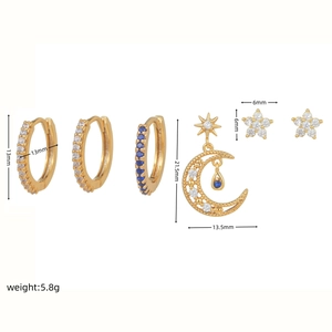 Detailed view of six-piece gold-plated earring set with blue and white zircon stones