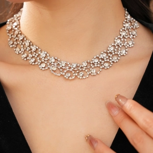 Close-up of sparkling diamond tassel necklace on neck with elegant silver finish