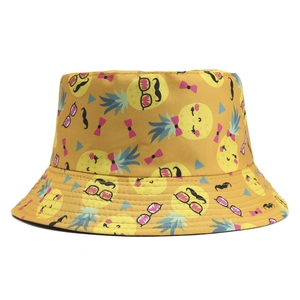 Reversible yellow bucket hat with fun cartoon pineapple print for summer casual wear