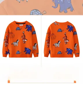 Detail of orange kids sweatshirt featuring hand-drawn cartoon animal patterns and cotton fabric