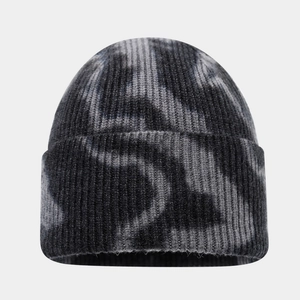Detailed view of the tie-dye ribbed knit texture and wide folded cuff of this street style beanie