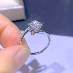 Classic four-prong 1ct cubic zirconia ring with twisted silver band and side stones