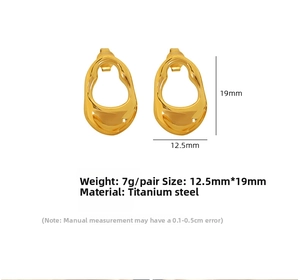 Macro detail of irregular wavy hollow stud earrings in gold titanium steel