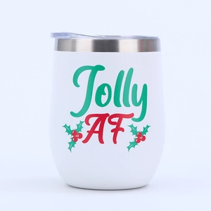 Close-up of 12oz stainless steel egg tumbler with Jolly AF Christmas pattern and lid