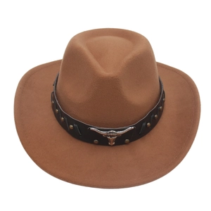 Detail of a brown felt cowboy hat featuring a black leather belt with a silver bull head logo
