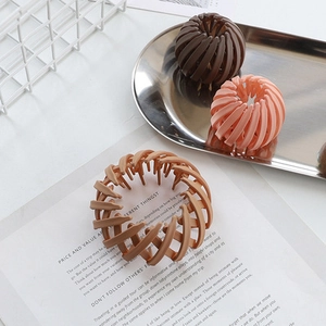 Matte bird nest telescopic hair rings in brown and coral for bun hairstyles