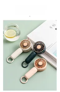 Three mini USB portable fans in cream, green, and pink with built-in carabiner clips