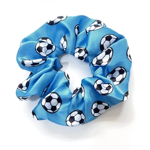 Blue satin scrunchie with football pattern featuring a glossy finish and elastic band