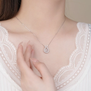 S925 sterling silver butterfly necklace with white agate pendant worn on neck