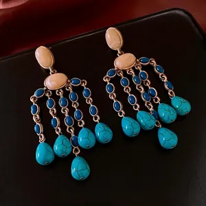 Vintage water drop tassel earrings with blue stones and turquoise on dark leather