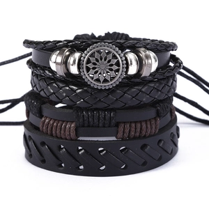 Multi-layer woven leather bracelet set featuring black and dark brown strands for men