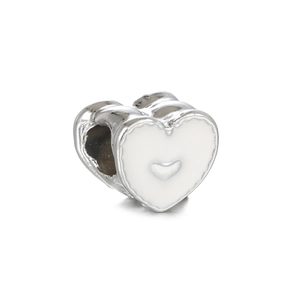 Macro shot of silver alloy heart bead with white enamel for DIY bracelet making
