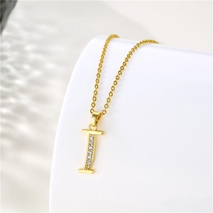 Detail of 18K gold-plated letter I pendant with zircons on stainless steel chain