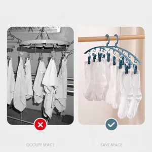 Blue plastic windproof hanger with clips holding white socks for multi-use drying