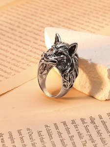 Macro view of vintage wolf head ring with detailed silver fur textures and hip-hop style