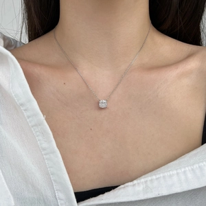 Close-up of S925 sterling silver necklace with a brilliant ice-cut zircon stone on a model