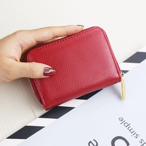 Compact red pebbled leather card holder with gold zipper for women and men