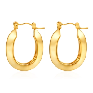 Detailed close-up of polished gold geometric hoop earrings with a sleek metallic finish