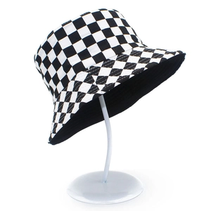 Detail of black and white checkerboard pattern on the reversible cotton bucket hat