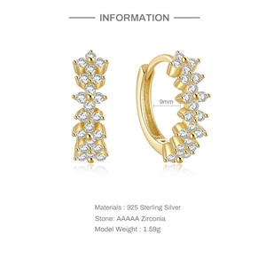 Macro detail of S925 sterling silver gold earring with AAAAA zircon and 9mm inner diameter