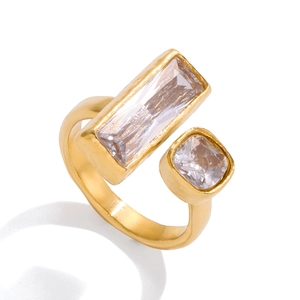 Gold open ring with rectangular and square zircons in a minimalist modern style