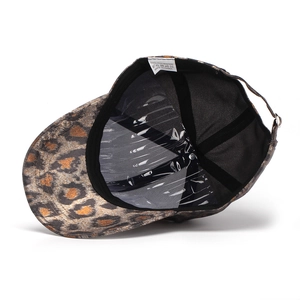 Detailed view of leopard print baseball cap interior with 100% polyester wash label