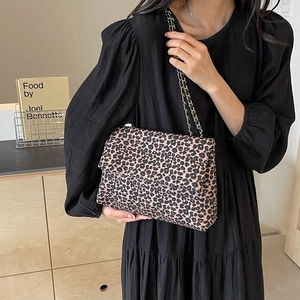 Stylish leopard print shoulder bag for women featuring a gold chain strap and animal pattern